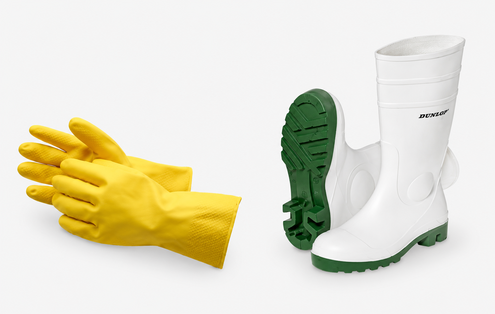 Gelbe Schutzhandschuhe und grüne Arbeitsstiefel